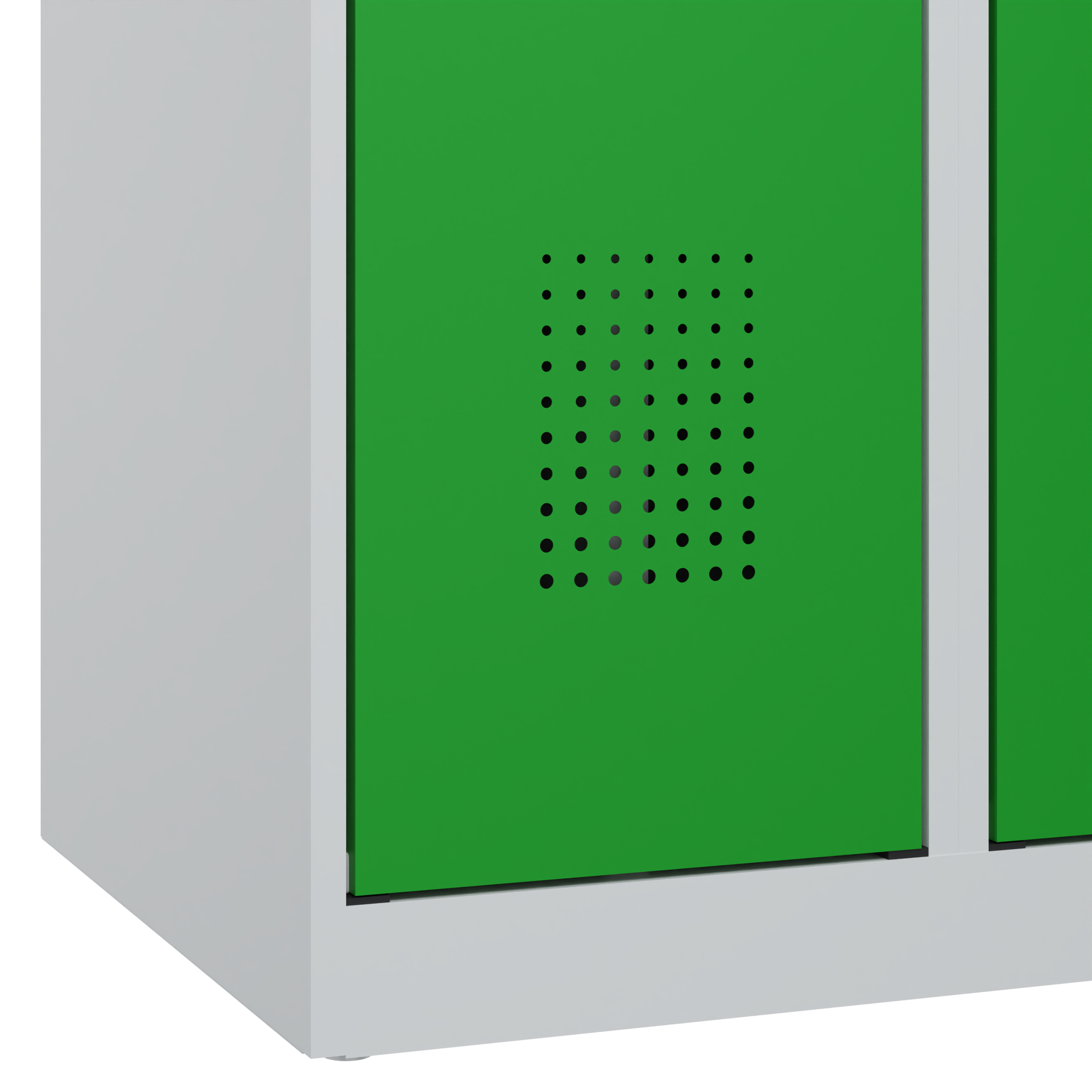 Grüner Metallschrank mit Lüftungslöchern, steht in heller Umgebung.