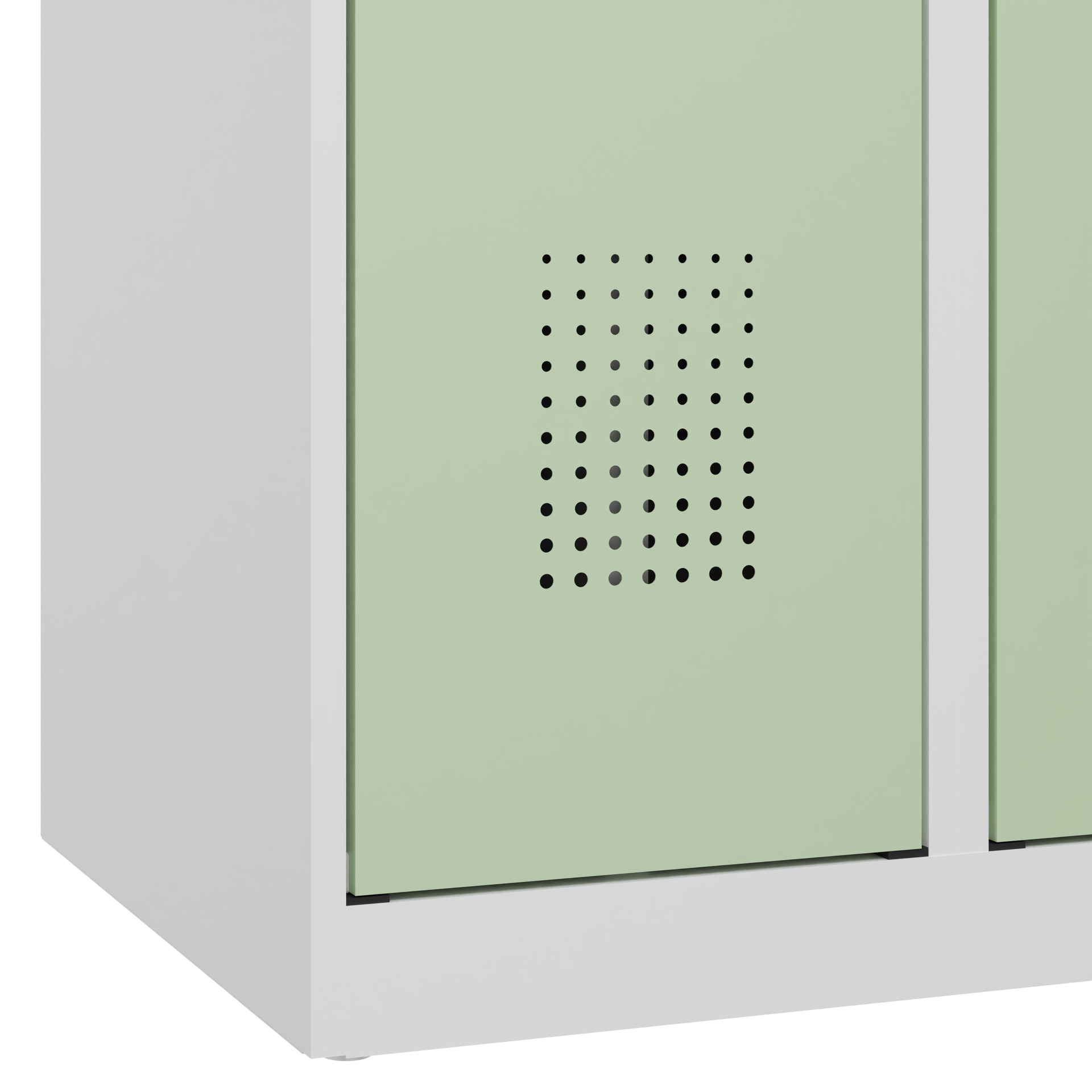 Grüner Schrank mit Lüftungslöchern in heller Umgebung.