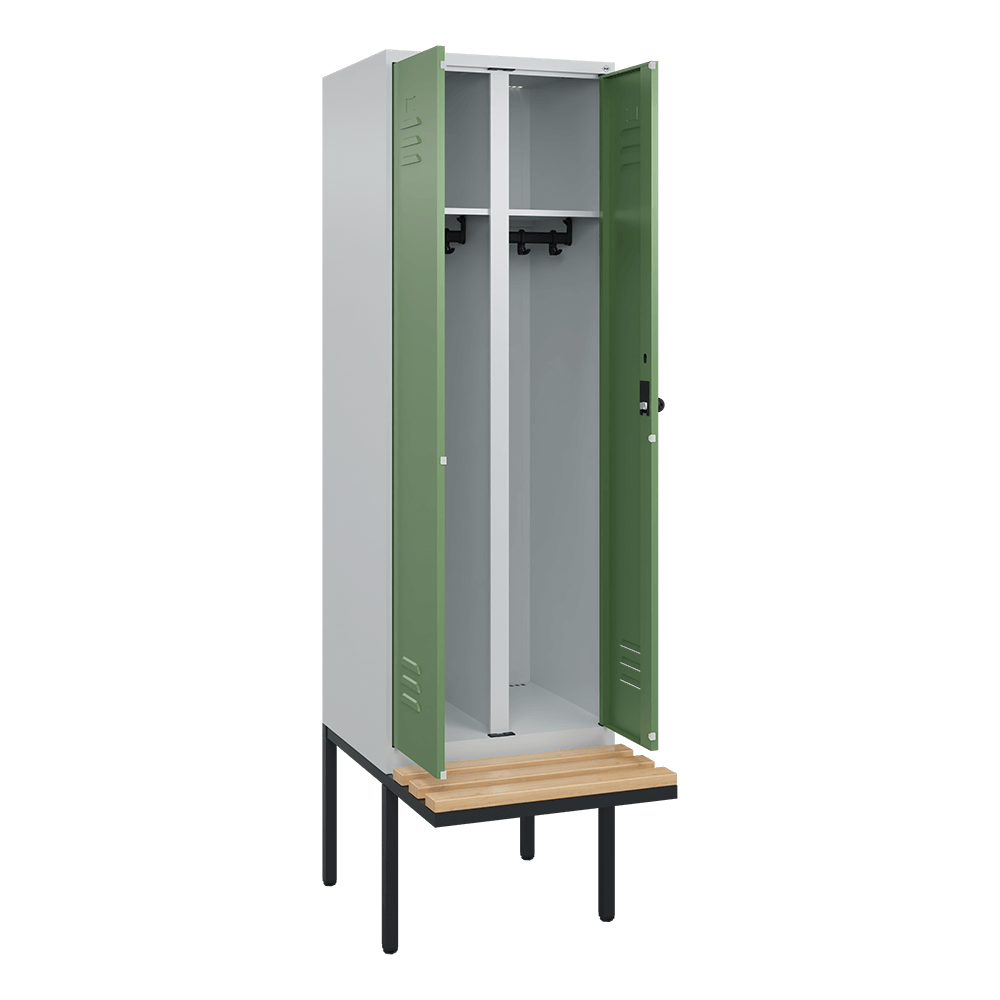 Metallschrank mit grünen Türen geöffnet in leerem Raum.